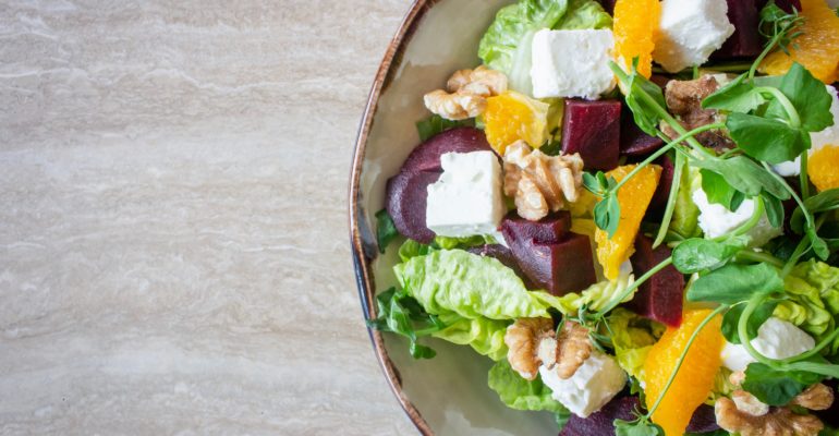 bowl of vegetable salad with walnuts