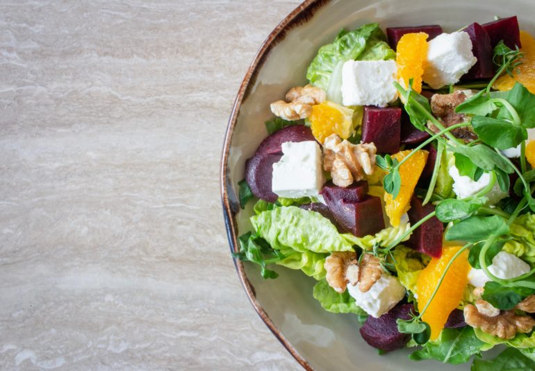 bowl of vegetable salad with walnuts